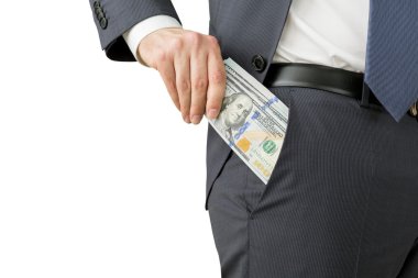 A man putting a one hundred dollar banknote into the chest pocket.