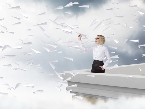 Woman with a paper plane — Stock Photo, Image