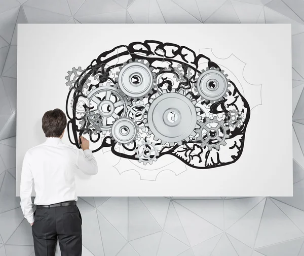 Businessman drawing image of brain with gears on white poster. — Stockfoto