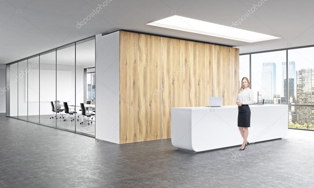 Office, white reception at wooden wall. Businesswoman in front.