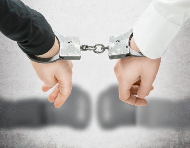 Hands in handcuffs. clipart