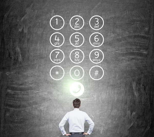 Businessman in front of number buttons — Stock Photo, Image