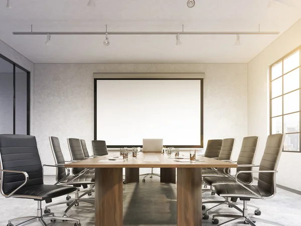 Big meeting room, blank poster on white wall behind table. — Stock Photo, Image