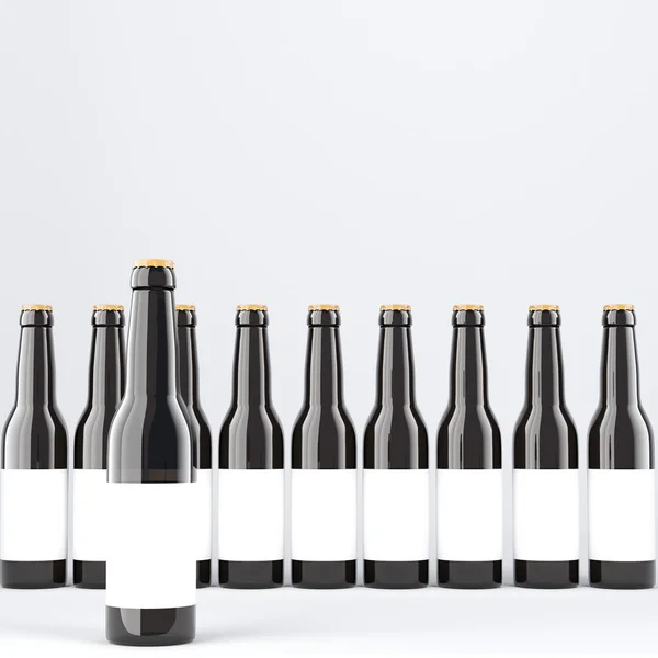 Row of wine bottles with blank labels, one in front. Dark glass. — Stock Photo, Image