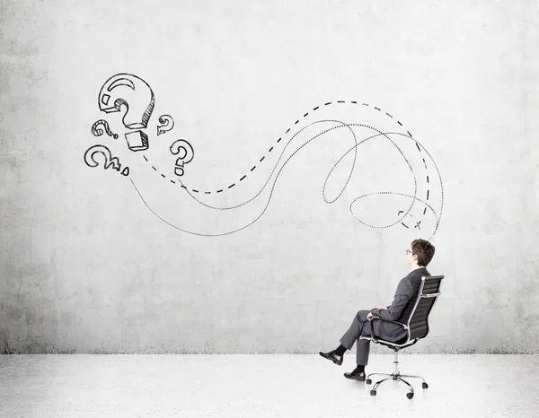 Businessman on chair, thinking — 图库照片