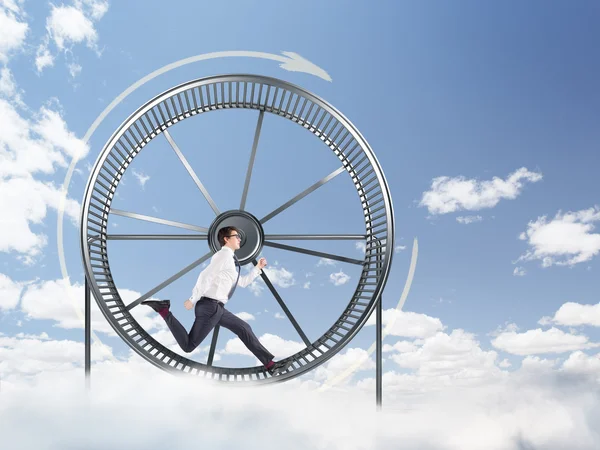 Man in spinning wheel — Stock Photo, Image