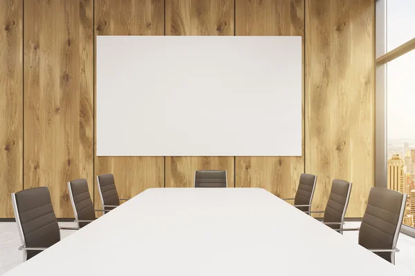 Big meeting room, blank poster on wooden wall behind table. — Stock Photo, Image
