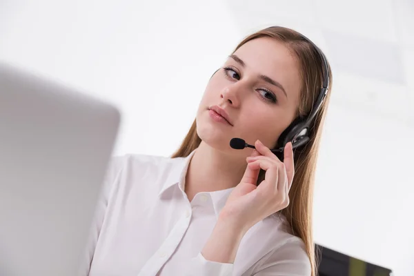 Businesswoman in headphones — Stock Photo, Image