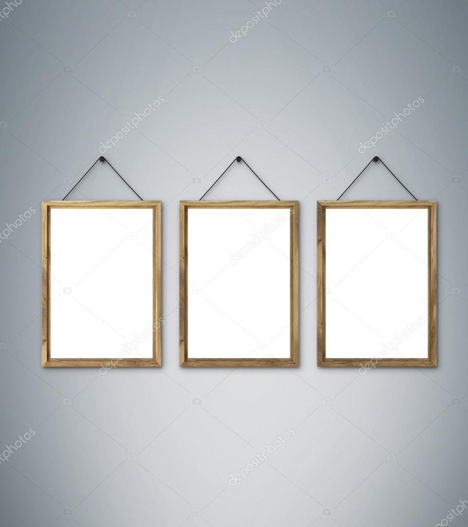 Three Blank Wooden Frames On Nails Grey Background Stock Photo Three Blank Wooden Frames On Nails Grey Background Stock Photo