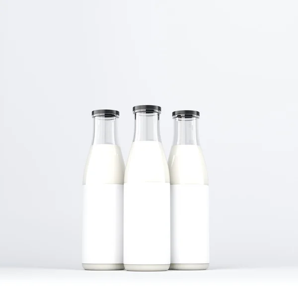 Tres botellas de leche con tapa negra. Vista frontal. Fondo gris. Concepto de producción de leche. Renderizado 3D . — Foto de Stock