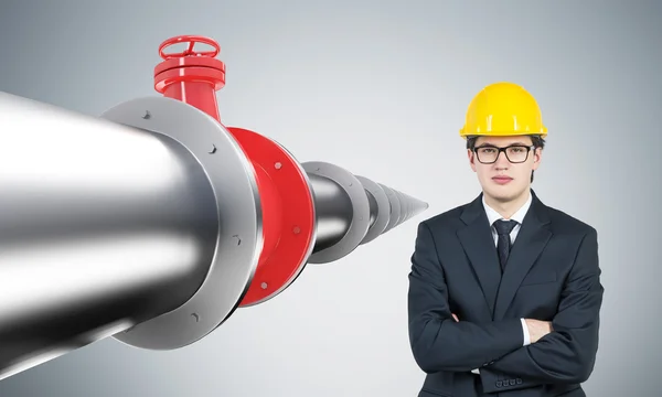 Businessman and pipeline — 图库照片