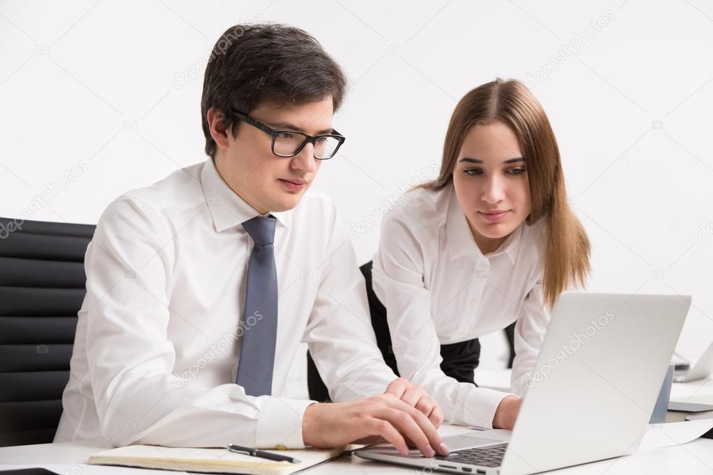 Businessman and businesswoman in office