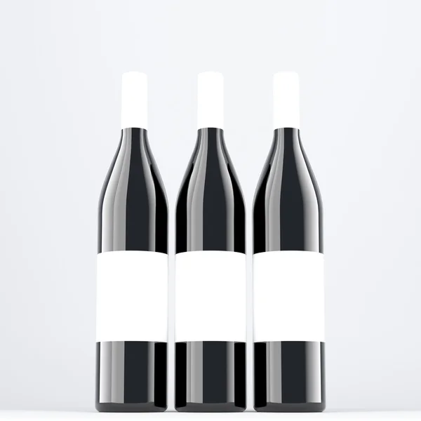 Vinflaska på grå bakgrund, närbild — Stockfoto