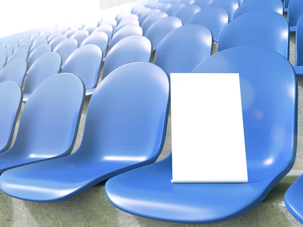 Placard en asiento azul en el estadio. De cerca. Concepto de publicidad deportiva . — Foto de Stock