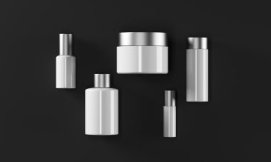 Farklı şekillerde krem kutuları. Siyah arka plan.