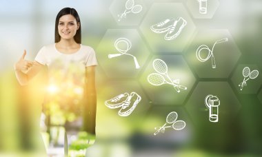 Young woman pointing at hexagonals with outdoor activities icons to the right. 