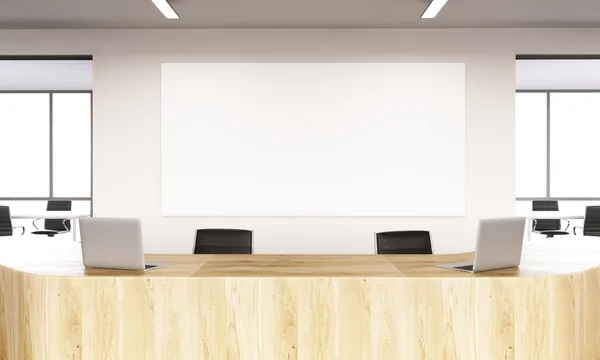 Empty reception with laptops, big white board on wall behind. Front view. Concept of reception. Mock up. 3D rendering — Stock Photo, Image