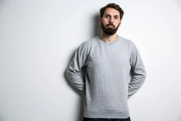 Young bearded man grey shirt — Stock Photo, Image