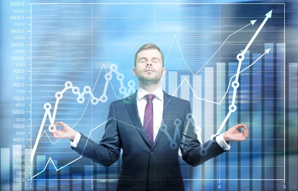 Meditando homem de negócios e gráfico — Fotografia de Stock