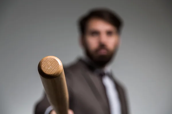 Blurry businessman and bat — Stock Photo, Image