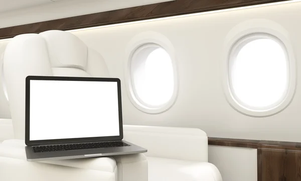 Blanker weißer Laptop im Flugzeug — Stockfoto