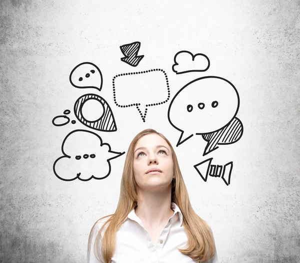 Thinking woman with speech bubbles — Stock Photo, Image
