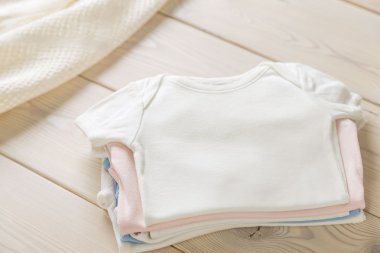 Pile of baby shirts clipart