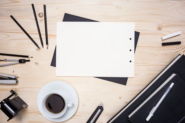 Table with paper and stationery — Stock Photo, Image