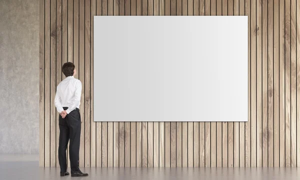 Man looking at poster — Stock Photo, Image