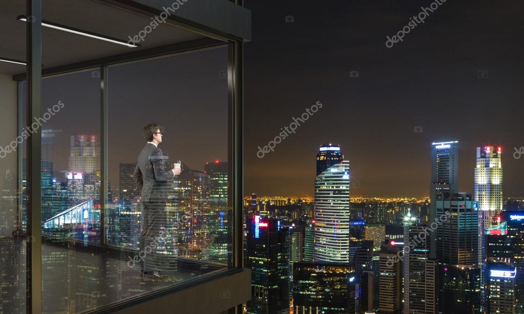 Businessman On Balcony At Night Stock Photo By C Denisismagilov