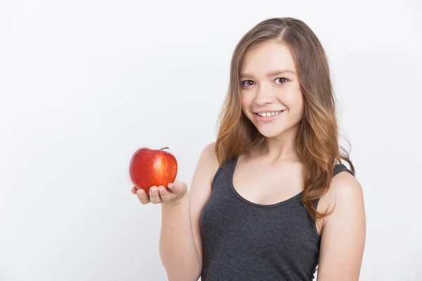 Chica sonriente con manzana —  Fotos de Stock