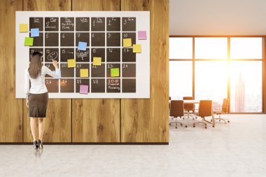 Woman and large calendar