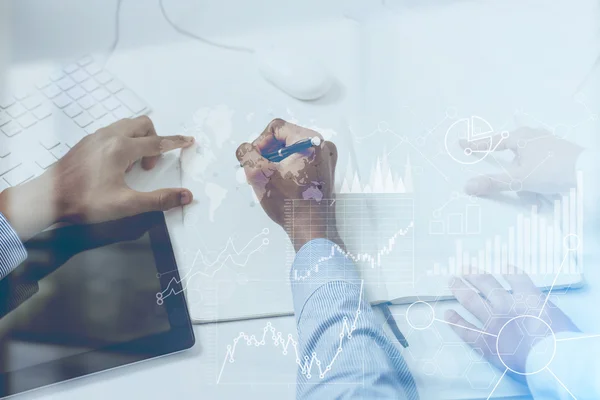 Two businessmen working at project together at office. Concept of cooperation. Toned image. Double exposure. Elements of this image furnished by NASA — Stock Photo, Image