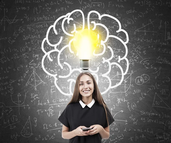 Girl and brain and lightbulb sketch on chalkboard — Stock Photo, Image