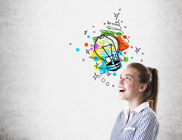 Side view of girl with light bulb sketch — Stock Photo, Image