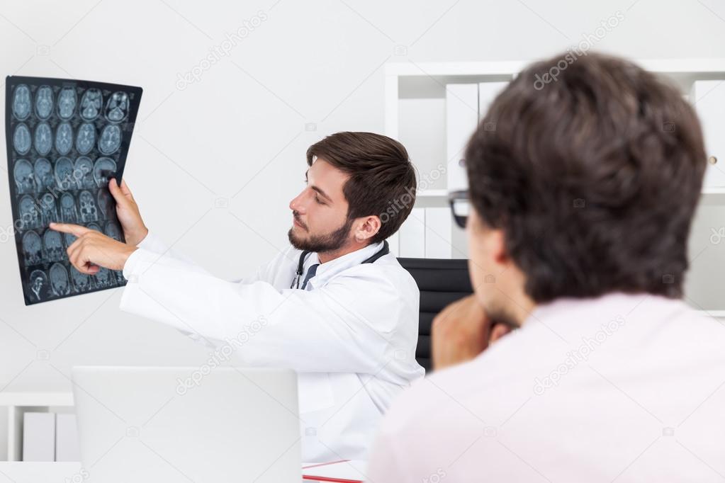 Doctor pointing at x ray