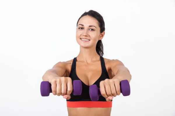 Sonriente chica dándote sus mancuernas — Foto de Stock