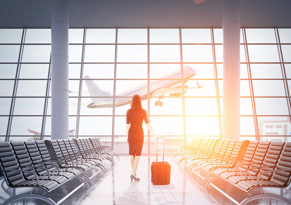 Woman in dress in airport