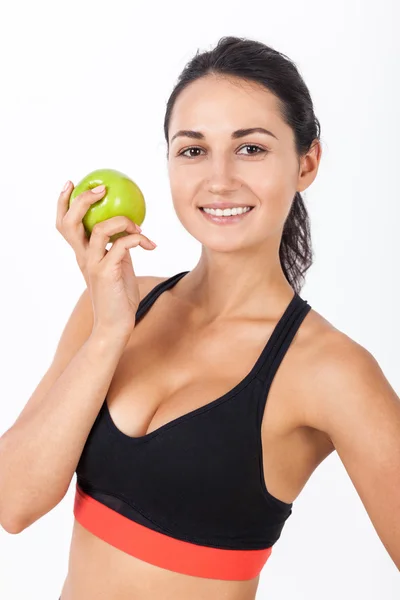 Close up of girl in sport bra with an apple — Stock Photo, Image