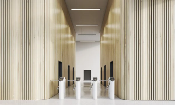 Turnstiles in office with wooden walls — Stock Photo, Image