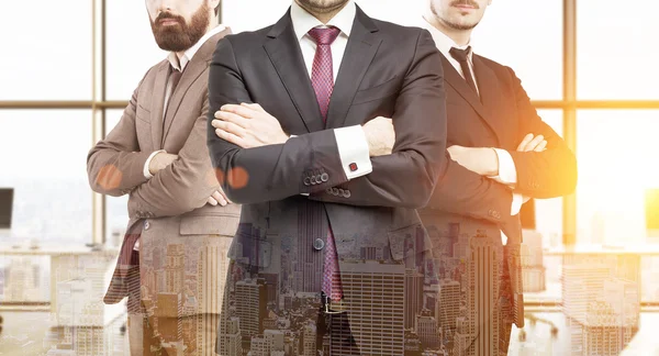 Three business partners in office with large windows — Stock Photo, Image