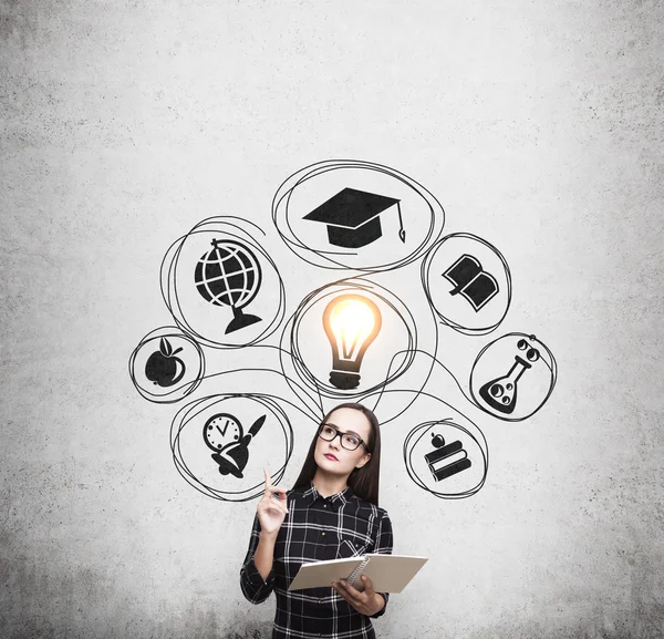 Nerd girl in dress and education sketches — Stock Photo, Image