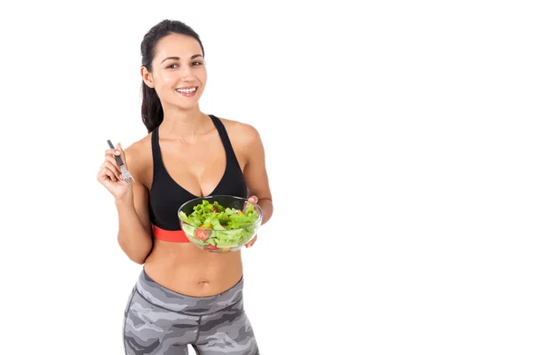 Sorrindo menina feliz comer sua salada — Fotografia de Stock