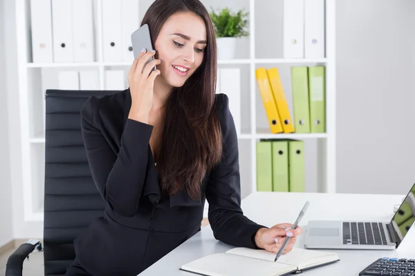 Communicating business lady in black — Stock Photo, Image