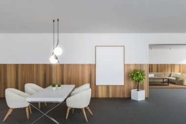 Beyaz ve ahşap duvarlı modern yemek odasının içi beton zemin, arka planda beyaz koltuklar ve oturma odası olan yemek masası. Dikey maket posteri. 3d oluşturma