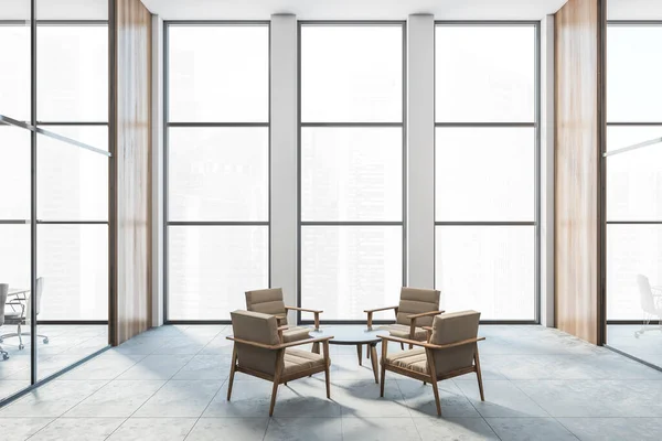 Four armchairs in a big bright wooden room in the office. Business meeting room for four people, with a small table in the centre big windows, no people, 3D rendering