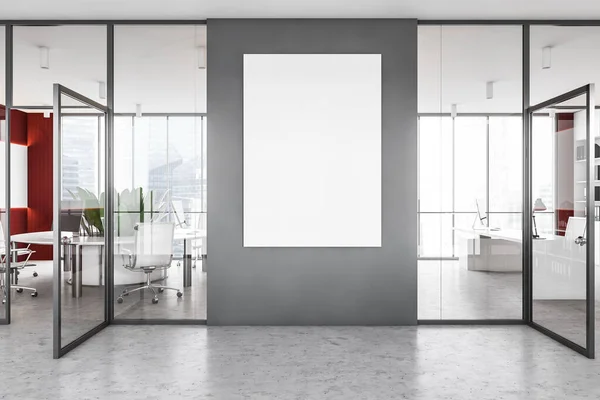 グレーの壁とコンクリートの床と現代のオフィスにぶら下がっている垂直モックアップポスター 広告の概念 3Dレンダリング — ストック写真