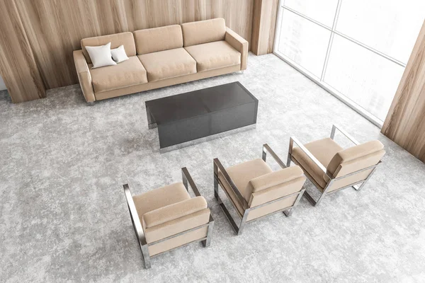 Brown sofa and chairs in light business office top view, waiting room for clients with a big window, view on skyscrapers. Wooden walls and grey floor with beige furniture 3D rendering, no people