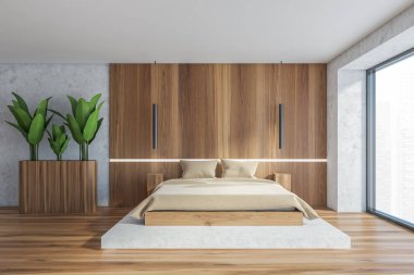 Beyaz ve ahşap duvarları, ahşap zemini ve bej battaniyeli rahat kral yatağı olan şık bir yatak odası. 3d oluşturma