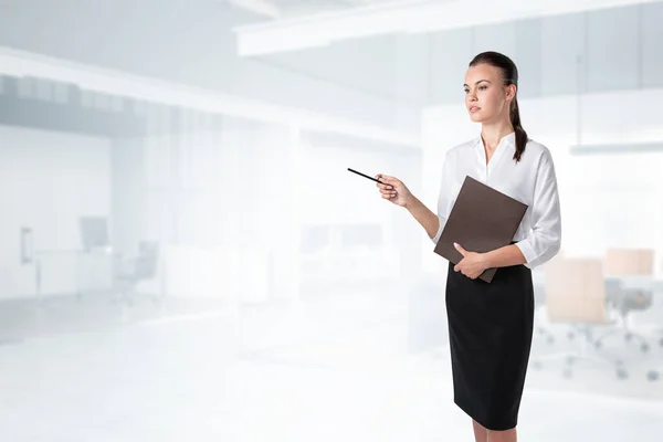Portrait Serious Young European Businesswoman Standing Folder Pen Blurry Office — Stock Photo, Image